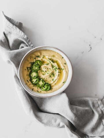 hummus in bowl with jalapenos