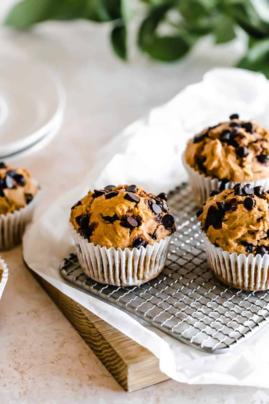 Muffins on a metal cooling tray.