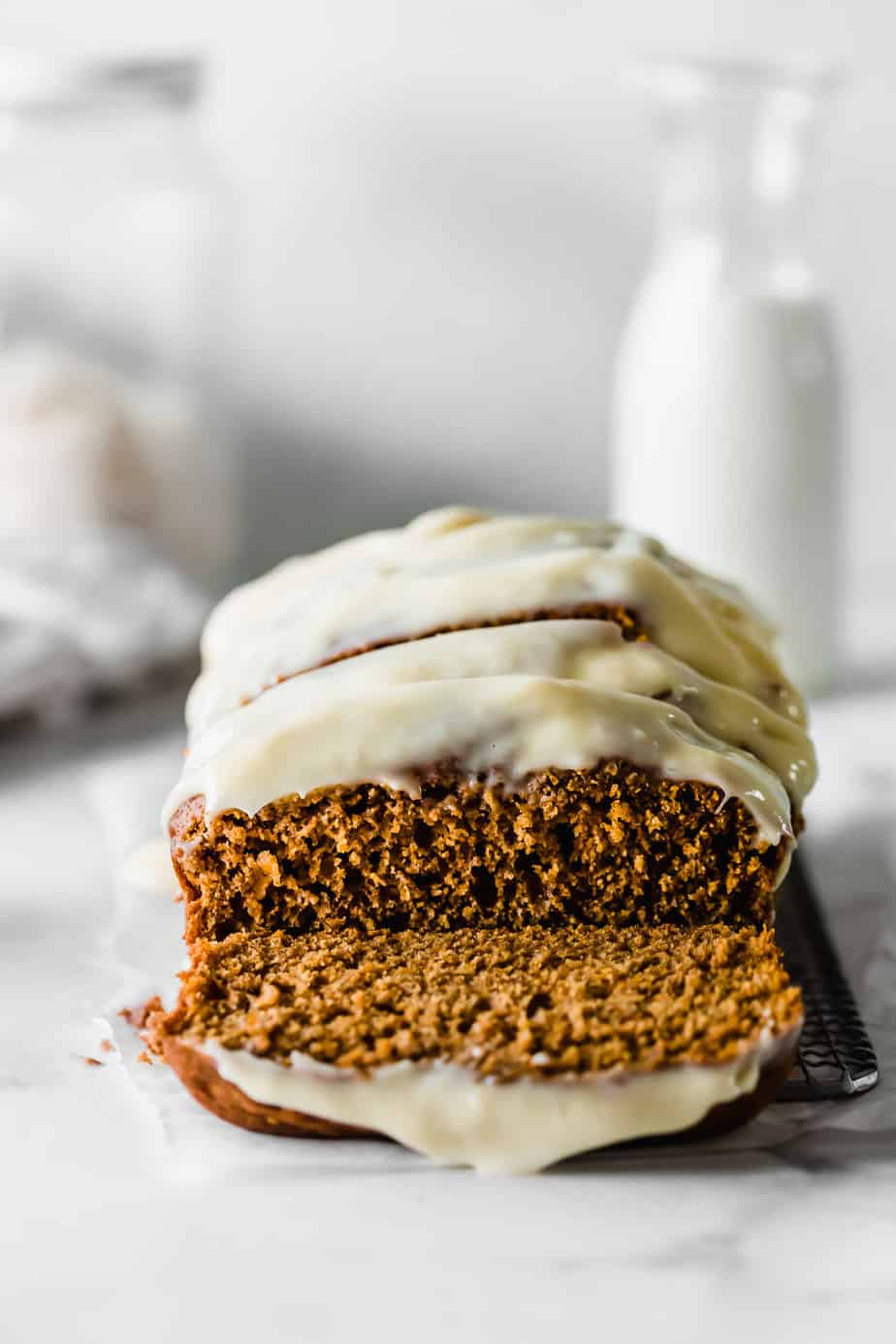 A pumpkin loaf with cream cheese frosting.