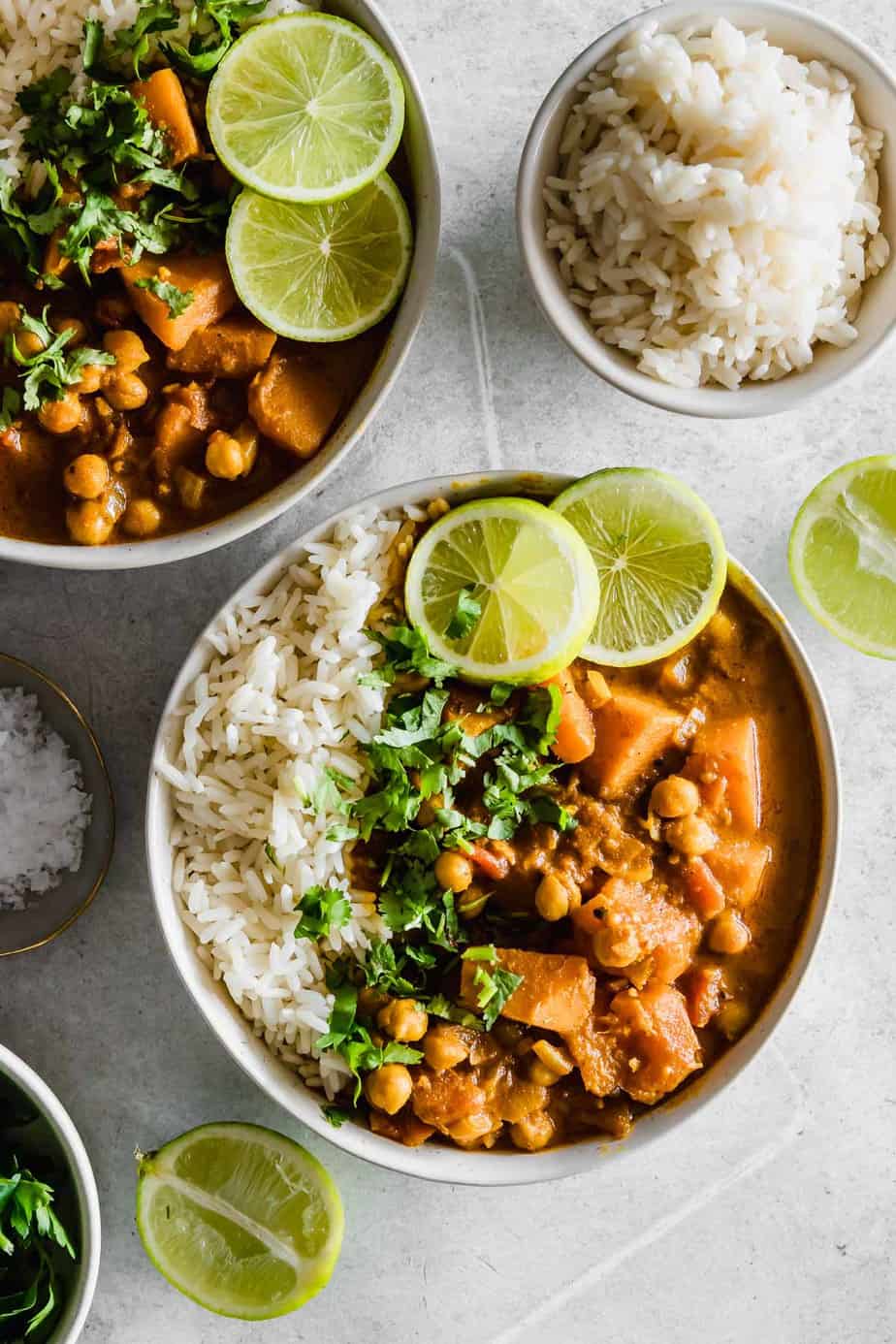 A bowl of pumpkin curry with chickpeas.