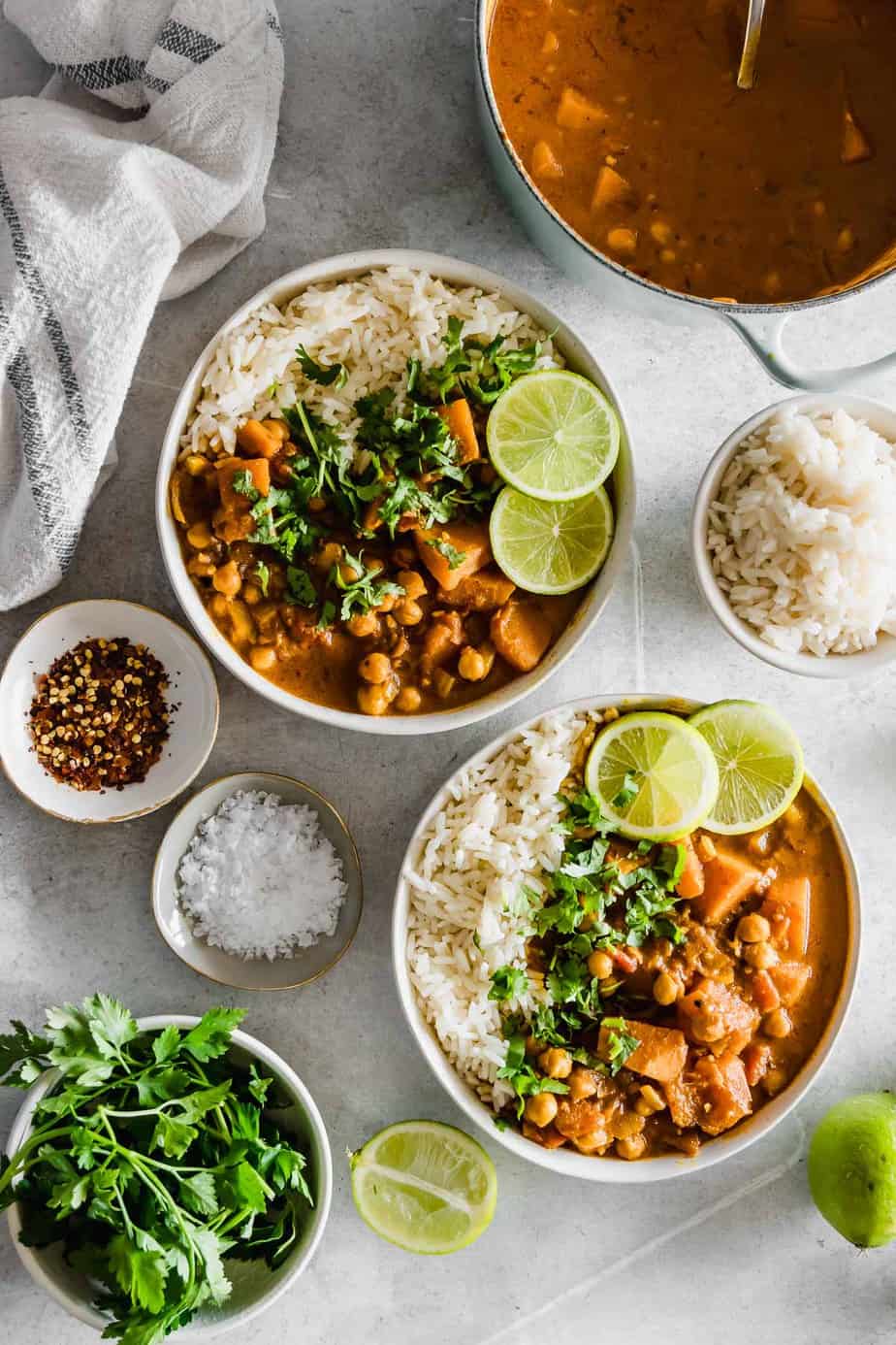 Vegan Chickpea Pumpkin Curry with limes and fresh herbs.