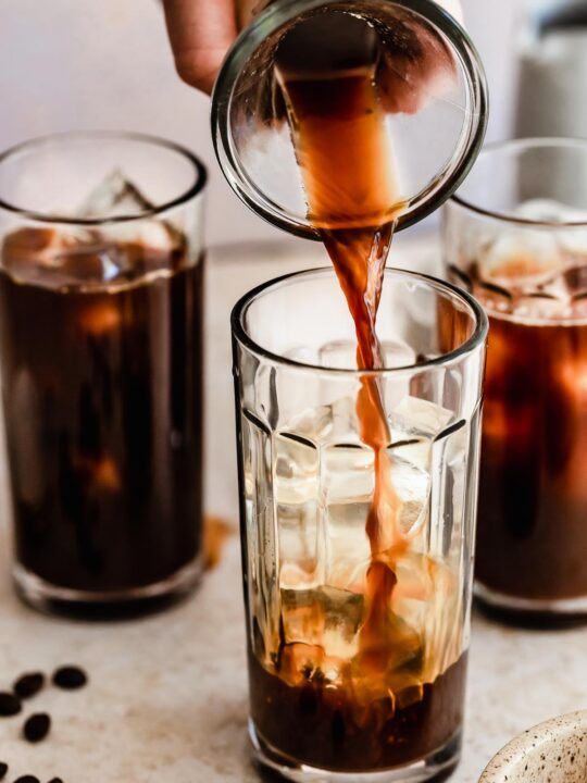pouring coffee for iced americano over ice