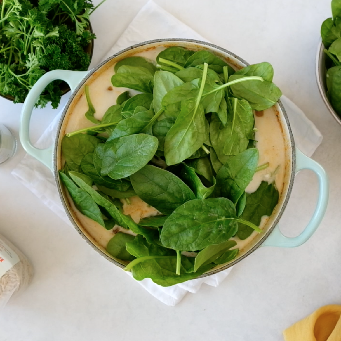 Spinach in a large pot.