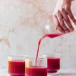three glasses with carrot and beetroot juice