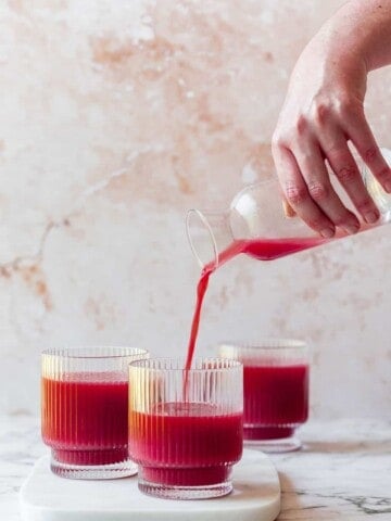 three glasses with carrot and beetroot juice
