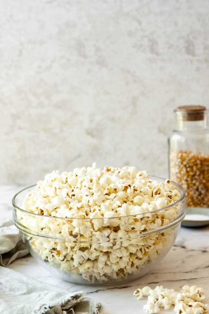 popcorn in glass bowl with marble background