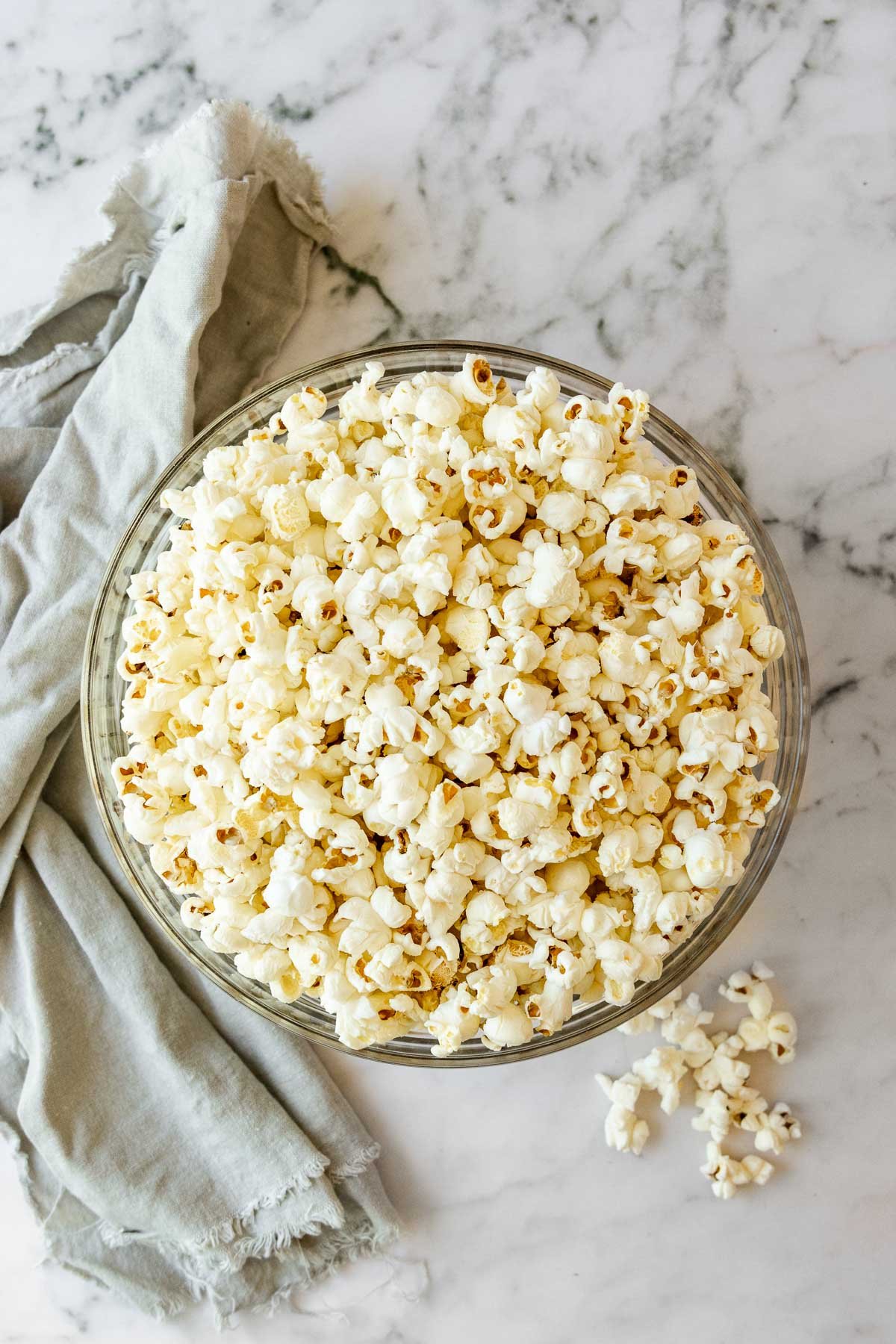 popcorn in glass bowl on marble