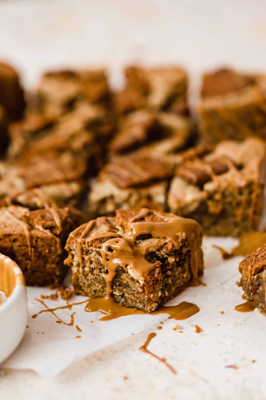 Biscoff Blondie with white chocolate and a drizzle of caramel sauce.