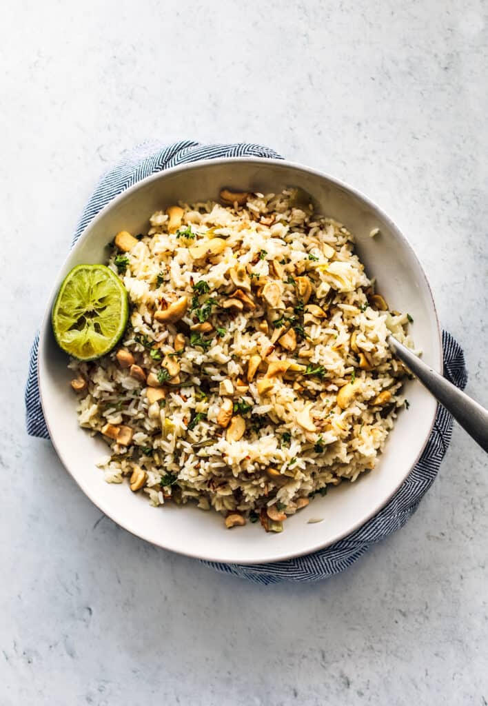 coconut ginger rice in large white bowl on grey background