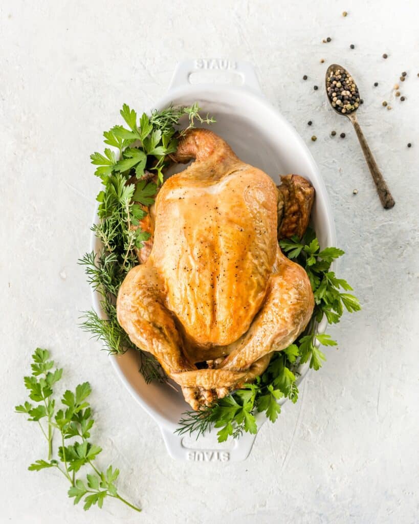 rotisserie chicken in white ceramic dish