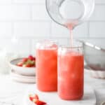 two glasses with cold strawberry drink