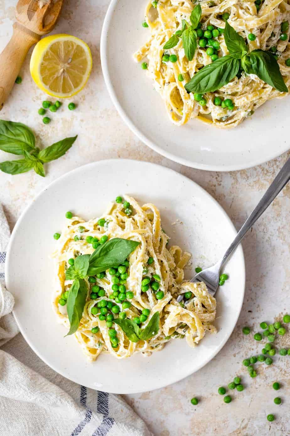 Two bowls of Ricotta Cheese Pasta with lemons and basil.