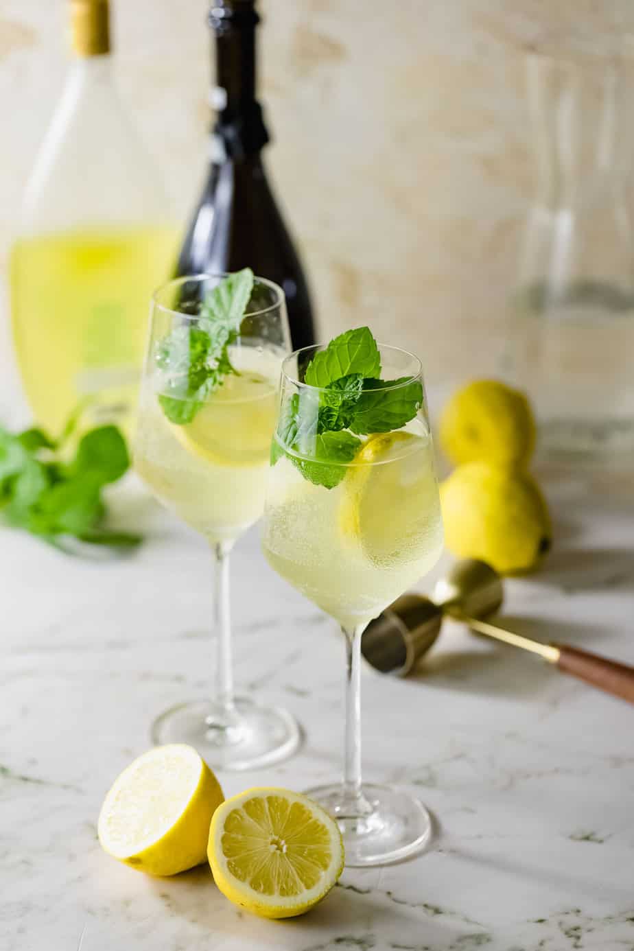 limoncello spritz cocktail in wine glasses with fresh mint