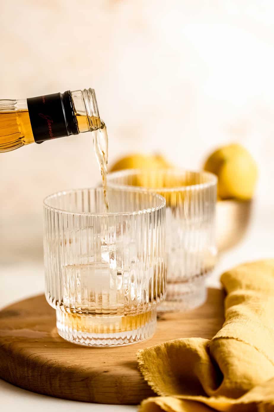 Whiskey being poured into a serving glass.