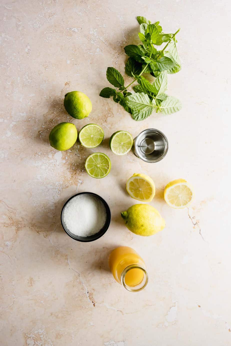 ingredients for mango mojito on pink background