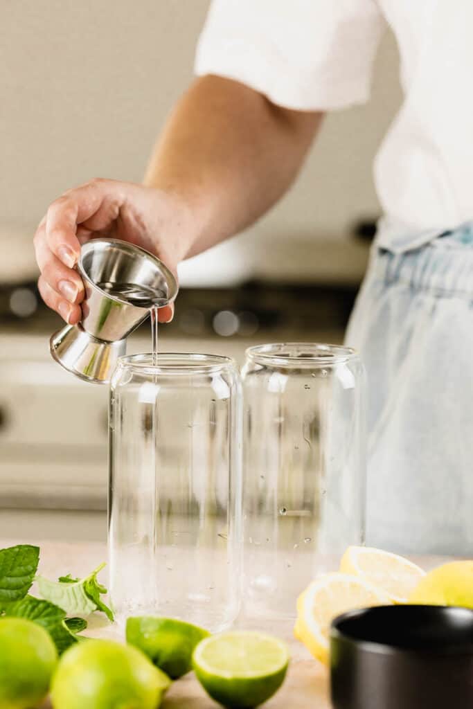 pouring rum into glasses