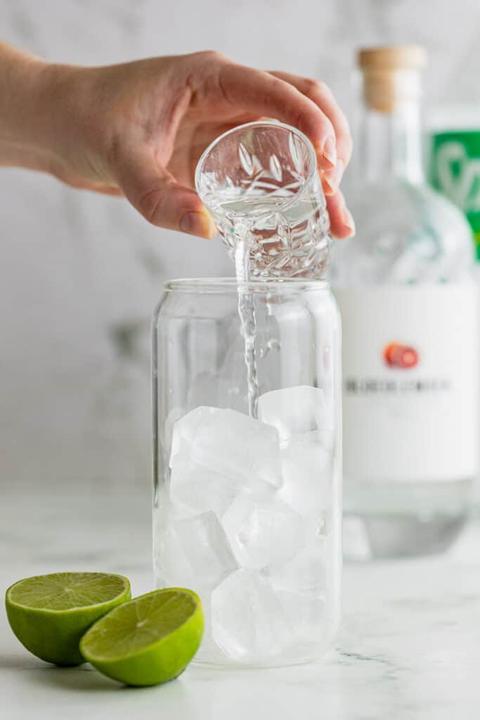 pouring gin over ice