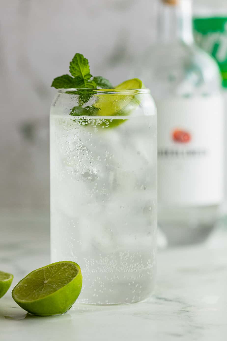 Easy two ingredient gin and sprite drink with fresh lime and mint
