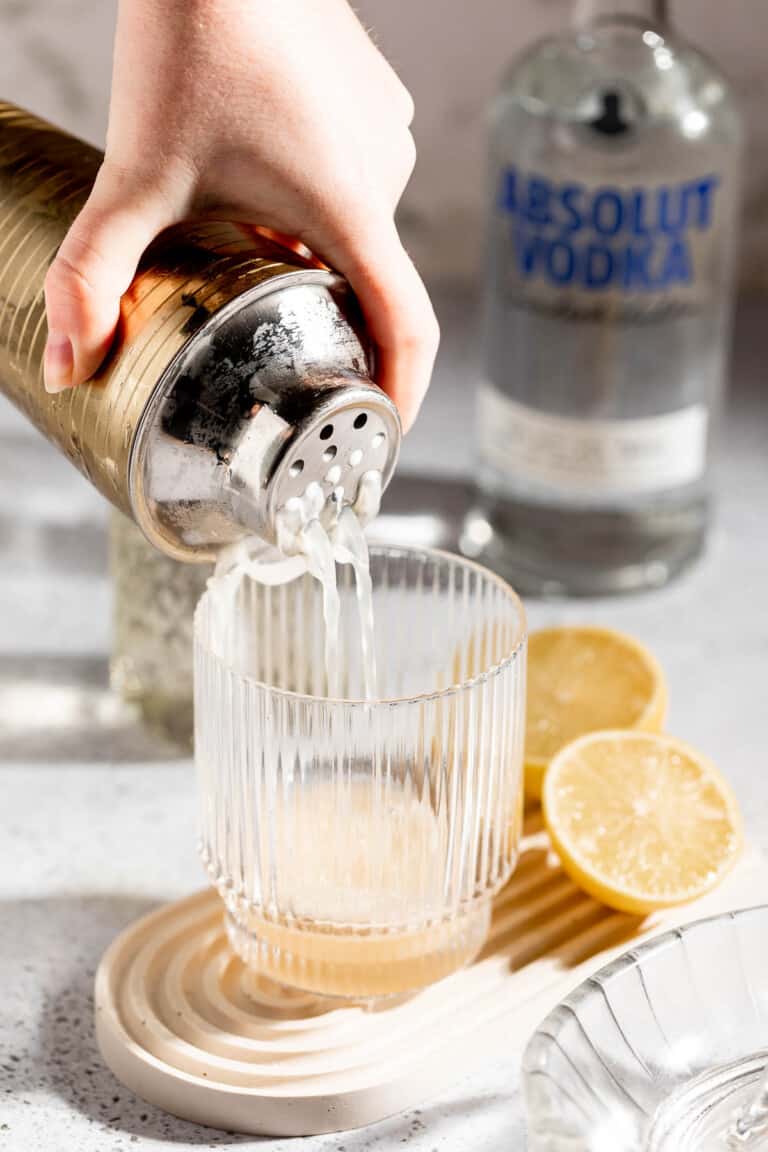 pouring cocktail into glass