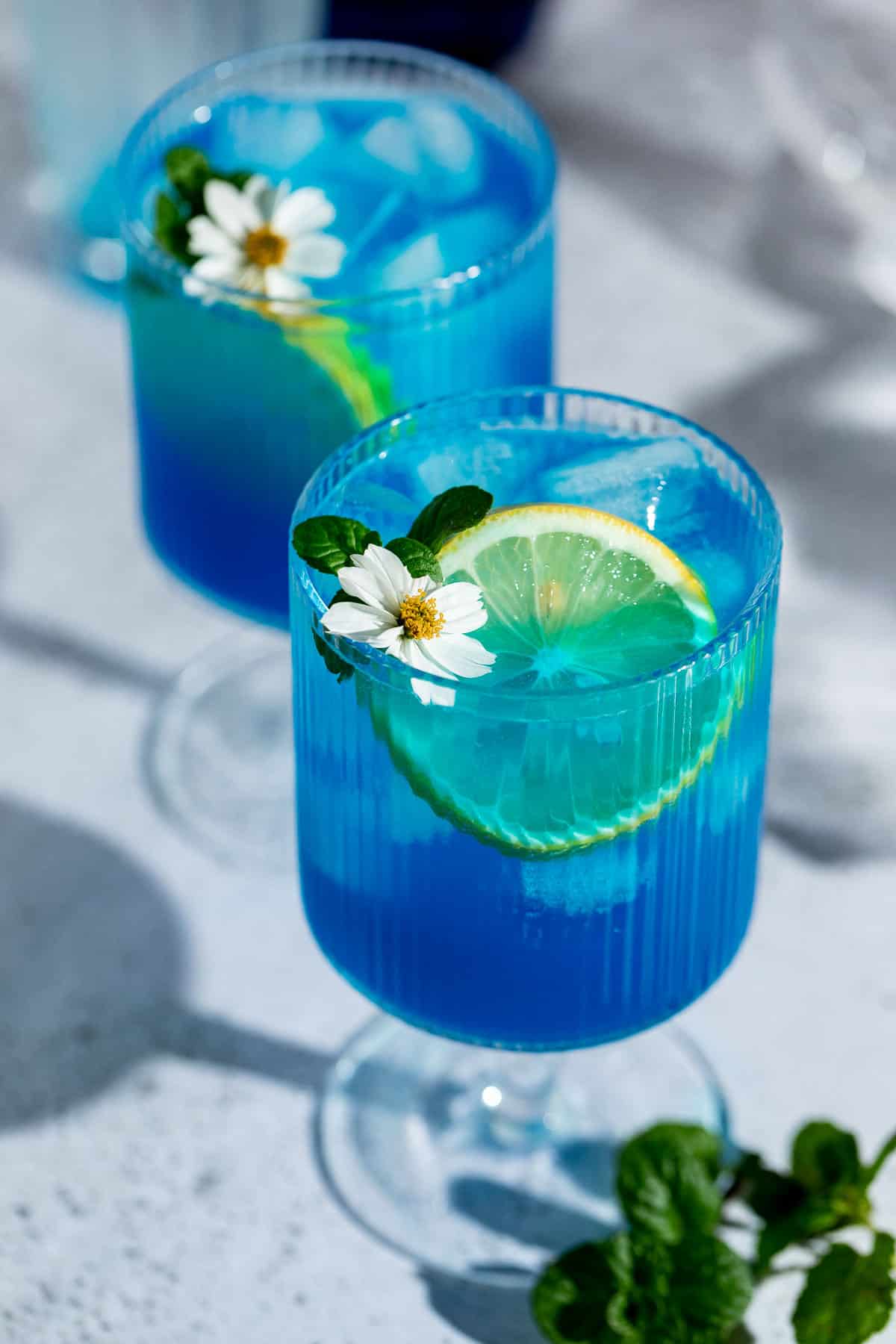 blue motorcycle drink in robbed glasses with fresh lemon slices