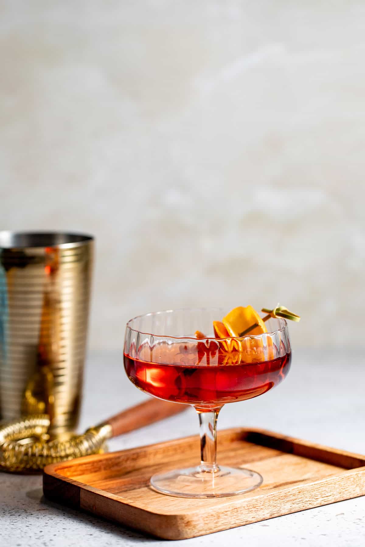 rob roy drink in coupe glass with orange rind